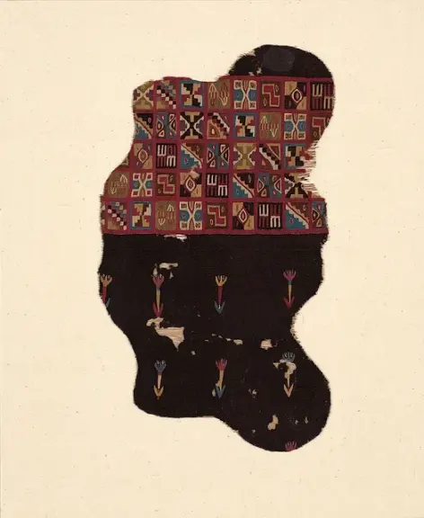 Tunic waistband fragment with small multicolored geometric designs.