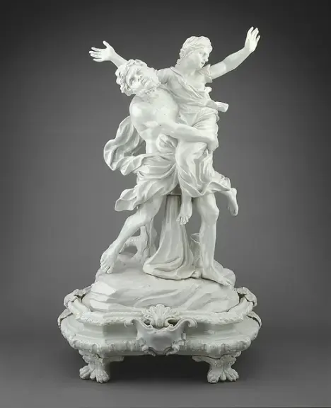 White porcelain sculpture of Boreas carrying Orithyia.