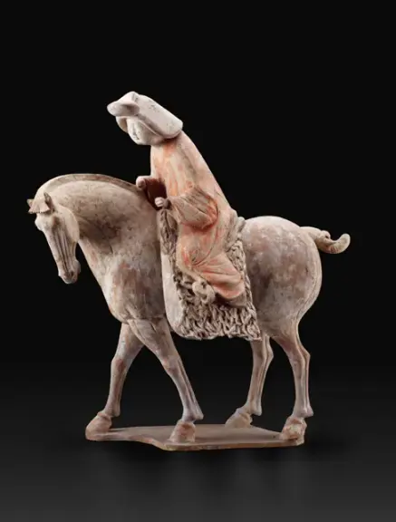Chinese earthenware figure of a woman riding a horse
