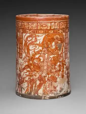 Cylindrical Maya vessel painted with dancing maize-god figures.