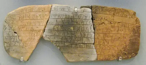 Linear B: Clay tablet (PY Ub 1318) inscribed with Linear B script, from the Mycenaean palace of Pylos.