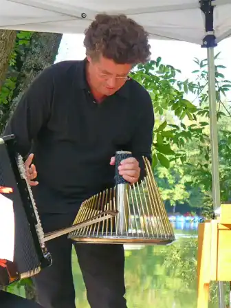 Thomas Bloch playing a waterphone.