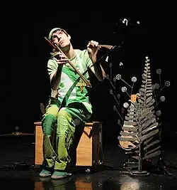 A musician playing a musical saw.