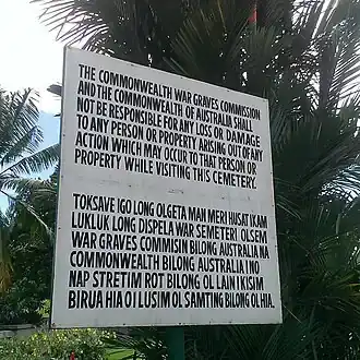 A public cemetery notice written in Tok Pisin.