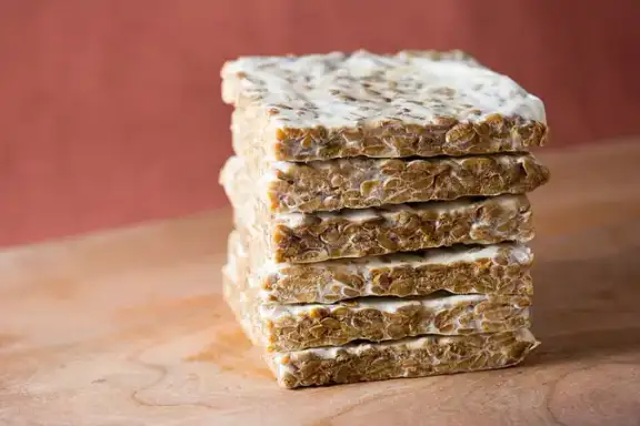 A block of fermented soybean tempeh.