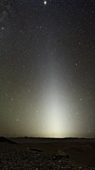 A faint wedge of zodiacal light rising above the horizon at Paranal Observatory.
