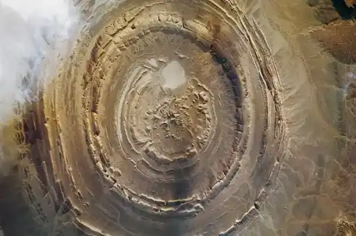 An astronaut photograph of the circular Richat Structure in the Sahara.