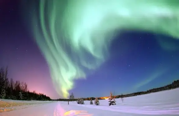 Green auroral curtains above Eielson Air Force Base in Alaska.