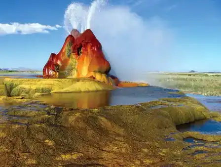 The colorful mineral mound and steaming water of Fly Geyser, Nevada.