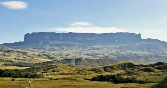 Mount Roraima's steep cliffs and flat summit rising above the landscape.