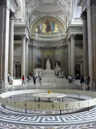 A Foucault pendulum suspended inside the Panthéon in Paris.